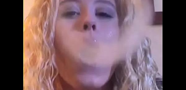  mature woman blowing smokerings